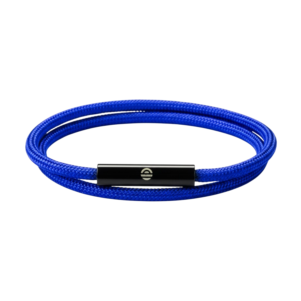 Blue braided bracelet with a black metal clasp on a dark purple background